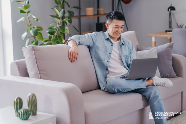 Expat-working-from-home-in-his-serviced-apartment Expat working from home in his serviced apartment.